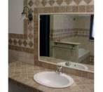 Bathroom with tiles light travertine and onyx